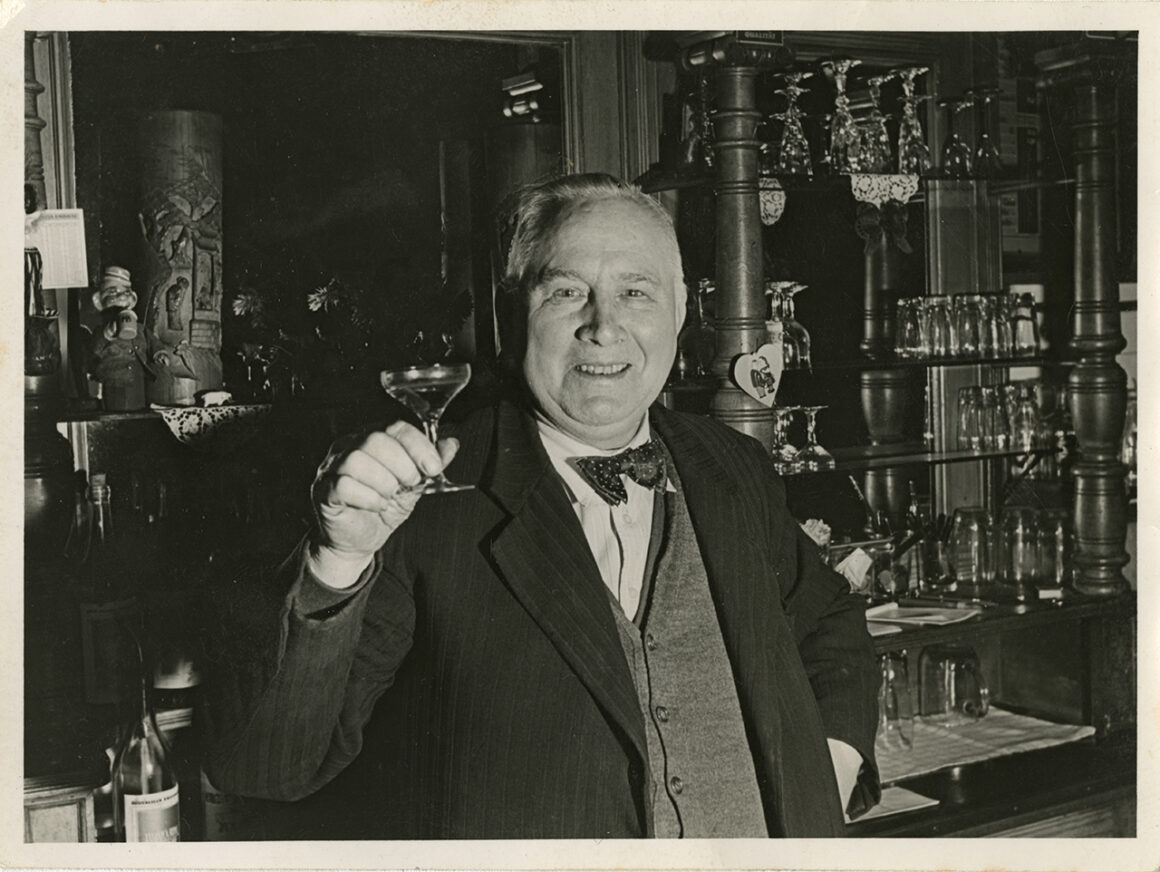 Christian Warlich behind the bar of his tavern, c. 1960