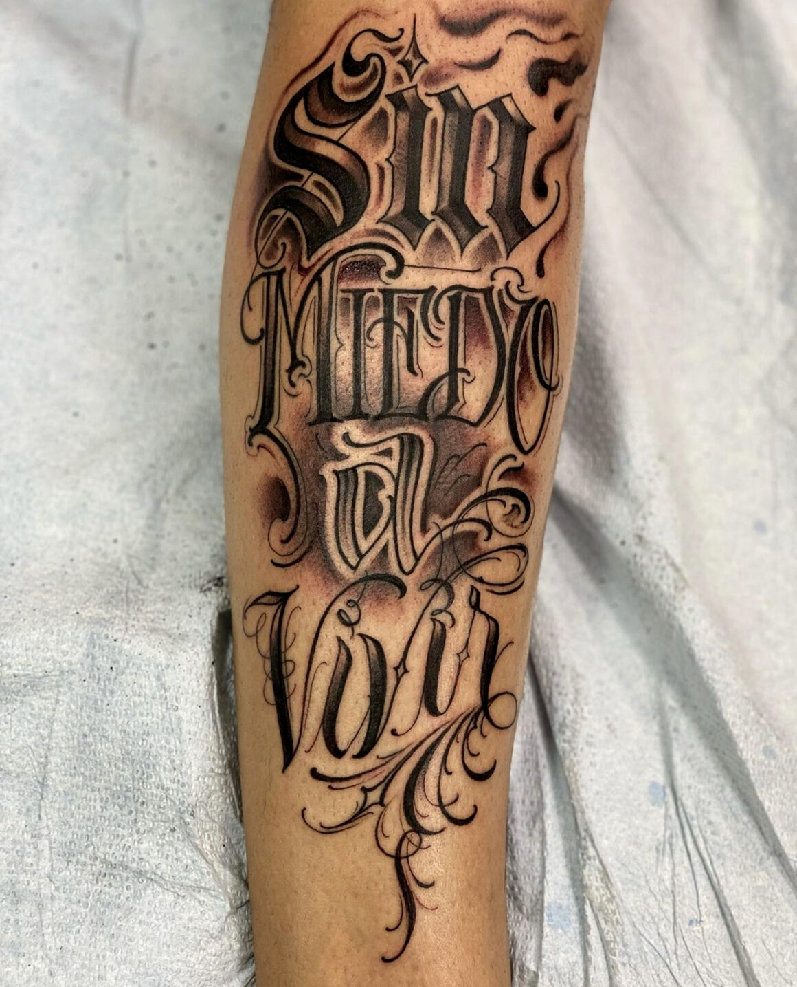 Lettering Breast Book Tattoo by Dna Tattoo